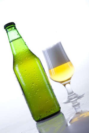 Glass of beer on a white background の写真素材