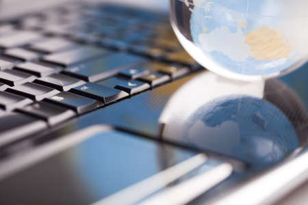 Notebook and earth globeの写真素材