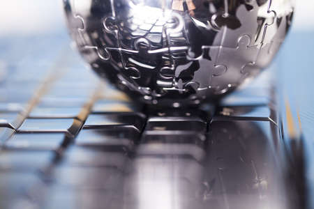 Notebook and earth globeの写真素材