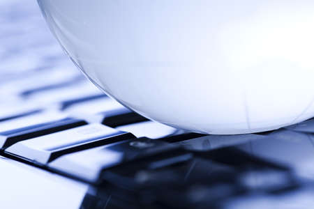 Notebook and earth globeの写真素材