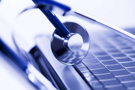 Laptop, notebook and Stethoscopeの写真素材