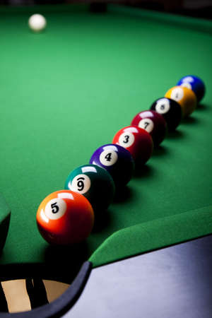 Pool game balls against a greenの写真素材