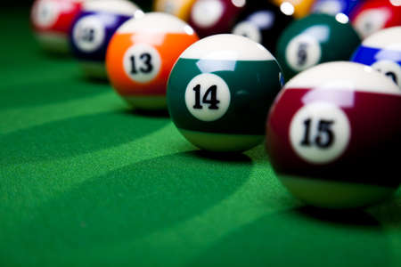 Pool game balls against a greenの写真素材