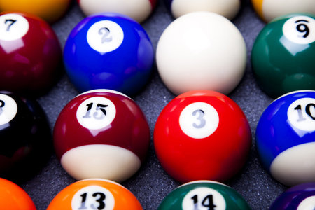 Pool game balls against a green