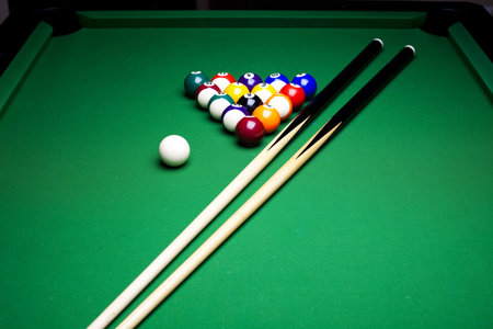 Pool game balls against a green