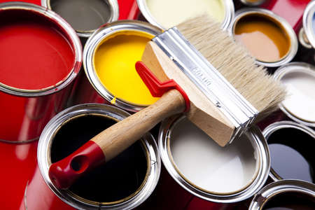 Cans of paint with paintbrushの写真素材