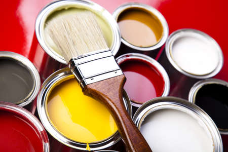 Cans of paint with paintbrushの写真素材