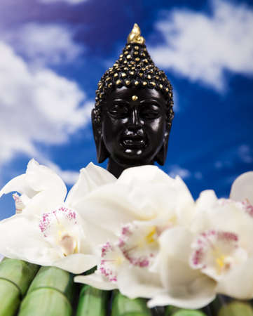 Buddha in Conceptual zen and blue skyの写真素材