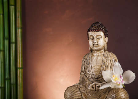 Still life with buddha statue and bambooの写真素材
