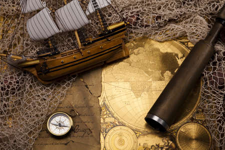 Antique brass compass over old mapの写真素材