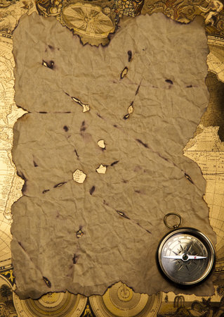 Old style compass and paper background