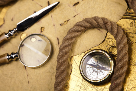Old style compass and paper background