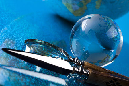 Magnifying glass and globe