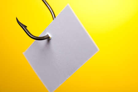 Blank on piece of paper on hookの写真素材