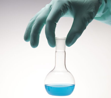  Scientist working in a laboratory , glass containing liquid color