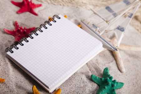 Copyspace blank paper on white beachの写真素材