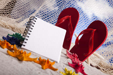 Copyspace blank paper on white beachの写真素材