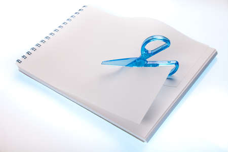 Scissors cutting paper の写真素材