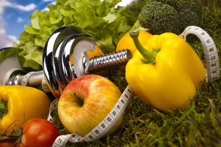 Vegetable and fitness in green grassの写真素材