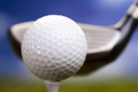 Playing golf, ball on tee の写真素材