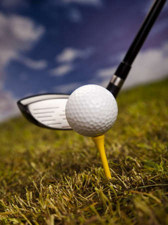 Golf club and ball in grass の写真素材