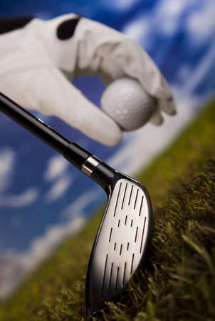Golf club and ball in grassの写真素材