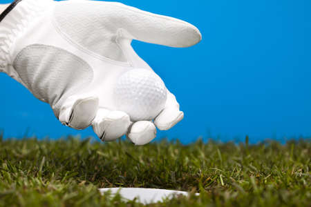 Hand and golf ballの写真素材