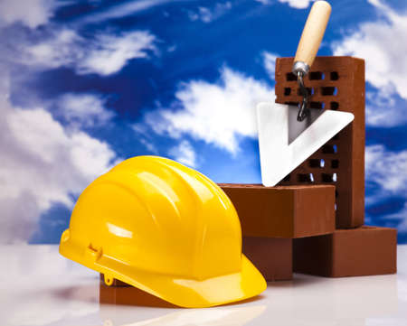 Building background, trowel and bricksの写真素材