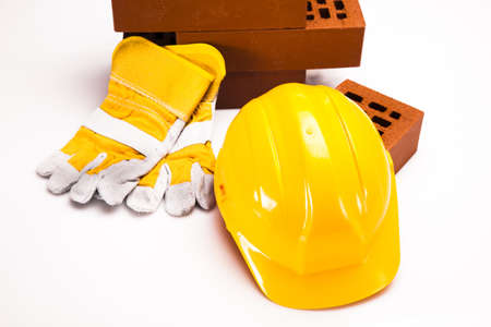 Hard hat with bricks and trowelの写真素材