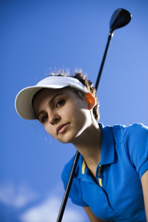 Girl playing golf の写真素材