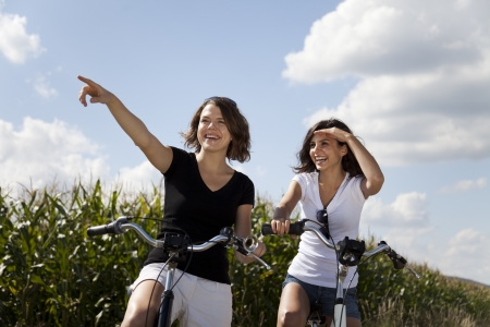 Girls on bike tour, enjoying の写真素材