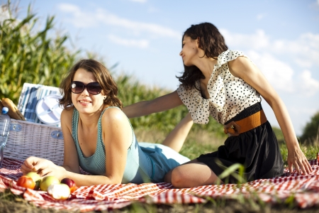Young women on nature picnicの写真素材