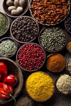 Spices on wooden bowl background の写真素材