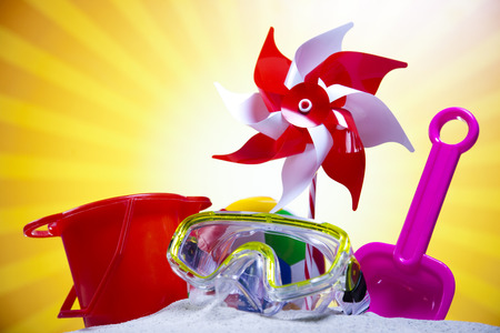 Toy windmill and beach accesories の写真素材