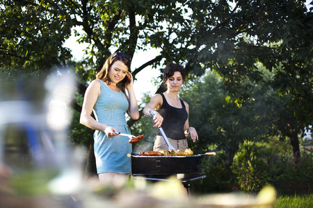 Two girls on grillの写真素材