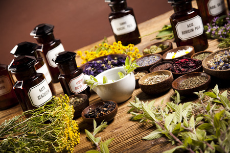 Medicine bottles and herbsの写真素材