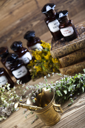 Medicine bottles and herbsの写真素材