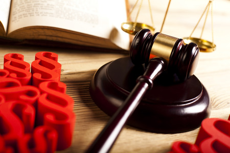 Wooden gavel barrister, weight scales and paragraph symbolの写真素材