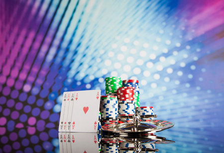 Poker Chips on a gaming with casino roulette