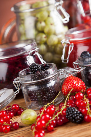 Set of glass jars with fruits jamの写真素材