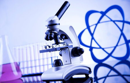 Laboratory work place with microscope and glassware
