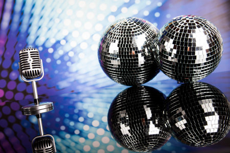 Retro style microphone on sound waves and Disco Balls