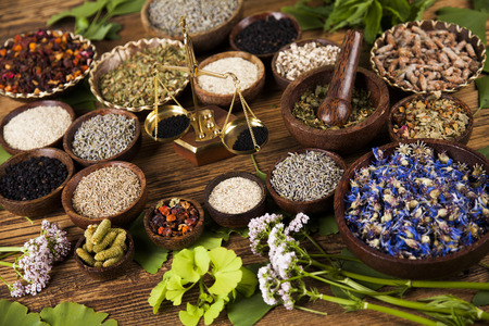 Herbal medicine, wooden table backgroundの写真素材