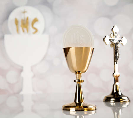 Holy communion a golden chalice, composition isolated on whiteの写真素材