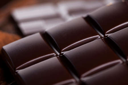 Aromatic cocoa and chocolate on wooden backgroundの写真素材