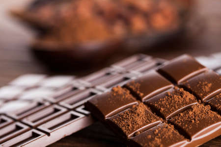 Aromatic cocoa and chocolate on wooden backgroundの写真素材