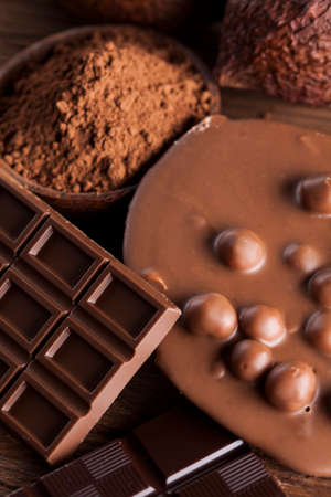 Aromatic cocoa and chocolate on wooden backgroundの写真素材