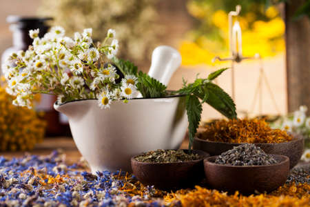 Natural medicine on wooden table backgroundの写真素材