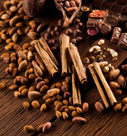 Chocolate sweet, cocoa pod and food dessert backgroundの写真素材