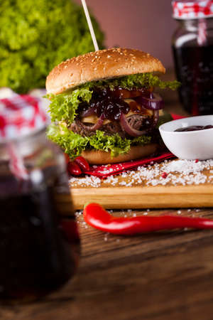 Home made hamburge, wooden desk backgroundの写真素材